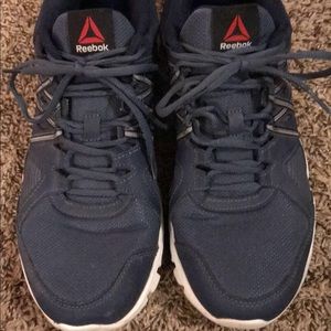 Blue or tan Reebok athletic shoes.